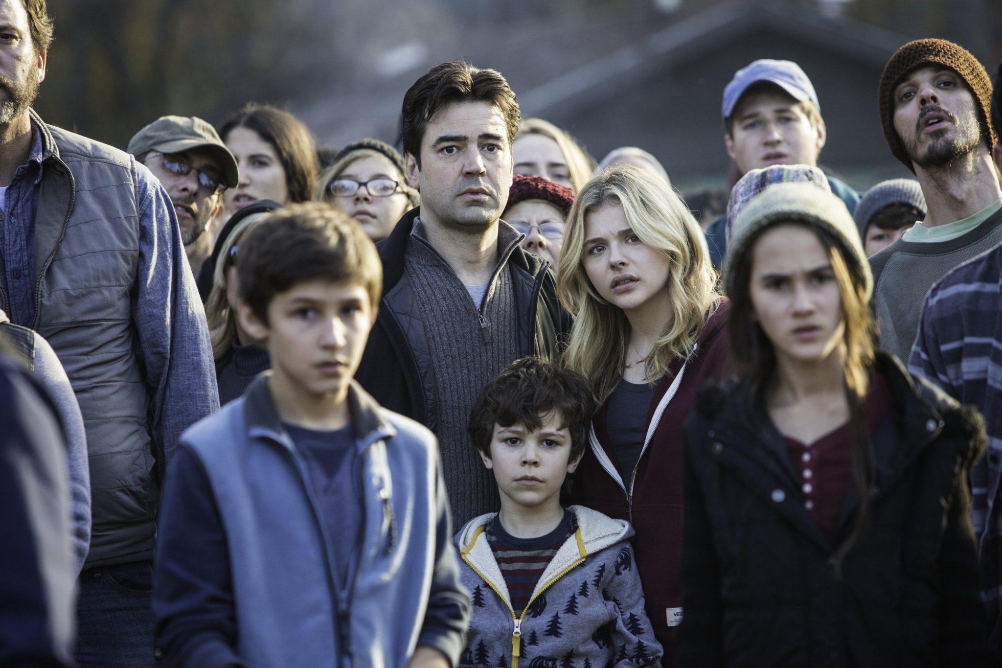 Ron Livingston, center left, and Chloë Grace Moretz, center right, and Zackary Arthur, below center, star in Columbia Pictures' "The 5th Wave."